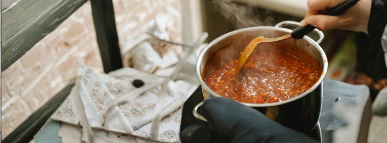 Bolognese sauce simmering in a pot, thick and rich