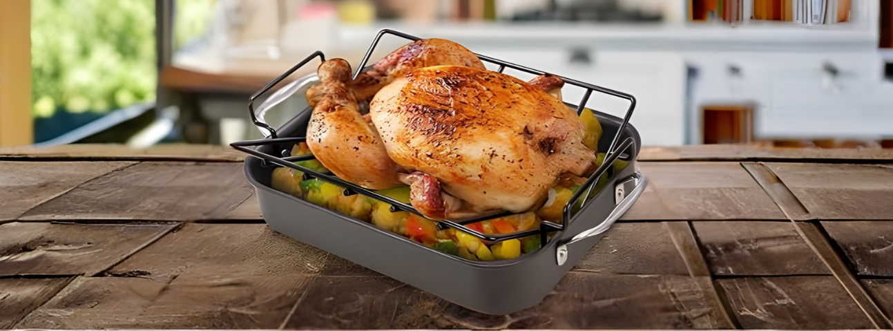 A roasting pan with a rack holding chicken vegetables arranged around it