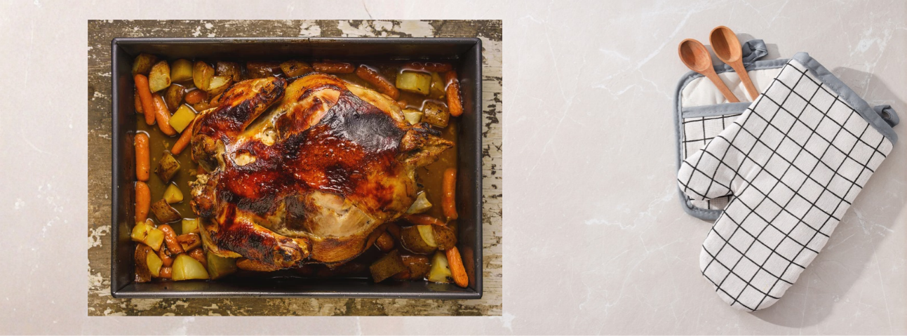 A whole roasted chicken in a roasting pan