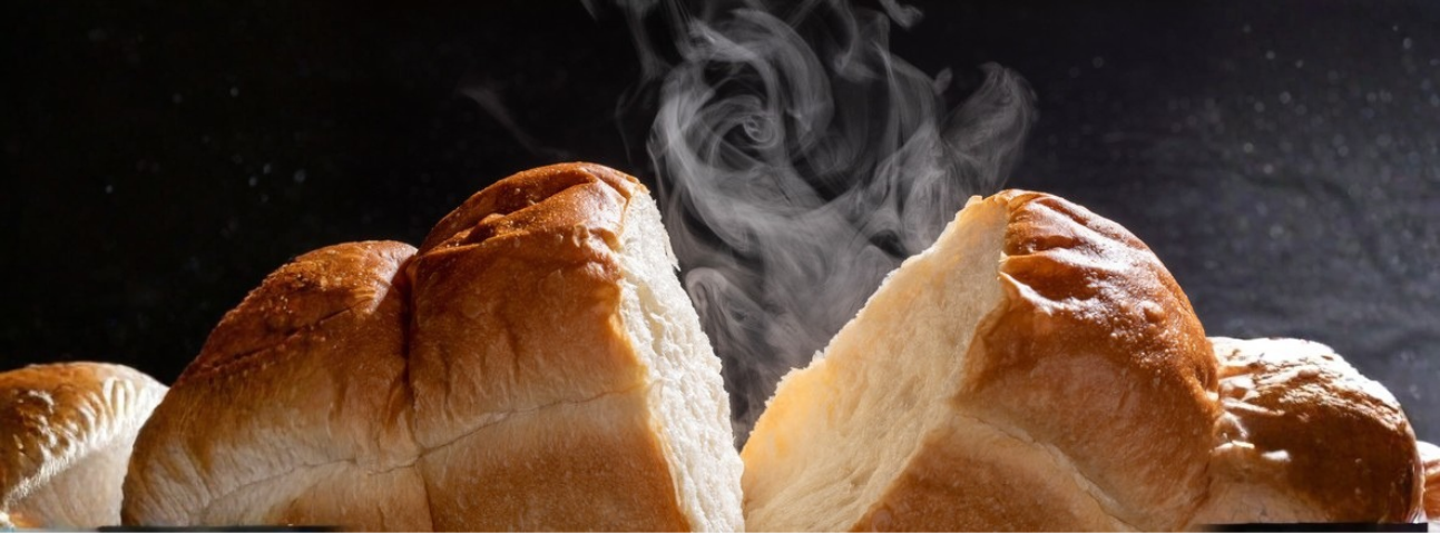 Freshly baked bread with steam rising