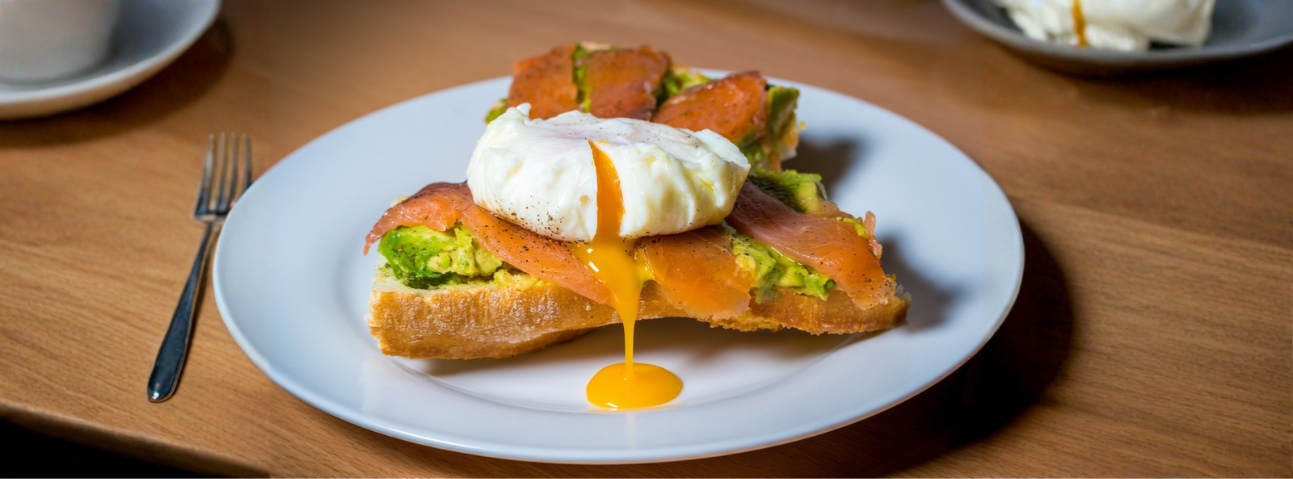 Poached egg salmon toast on a plate