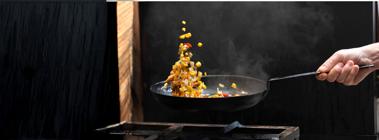 Vegetables sautéing in a skillet