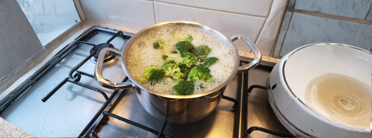 broth pot at a gentle simmer on a stovetop