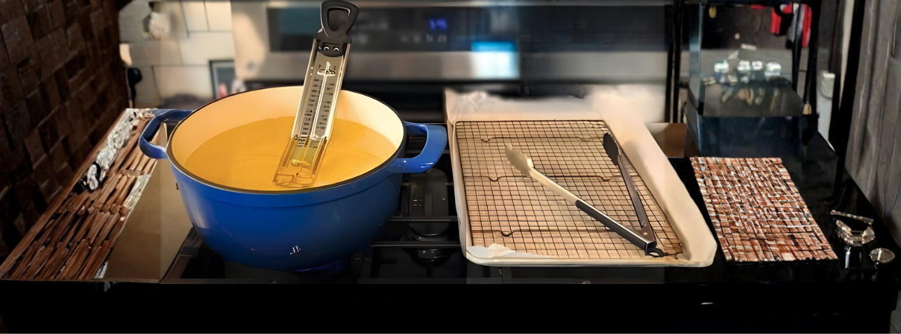 hot oil with a thermometer monitoring temperature