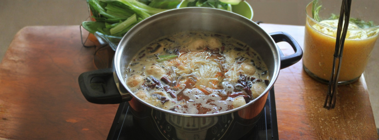 pot with small bubbles rising gently at the surface